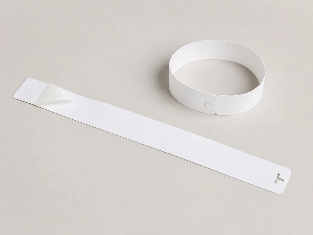 Direct-print thermal wristband shown flat and closed with an adhesive end