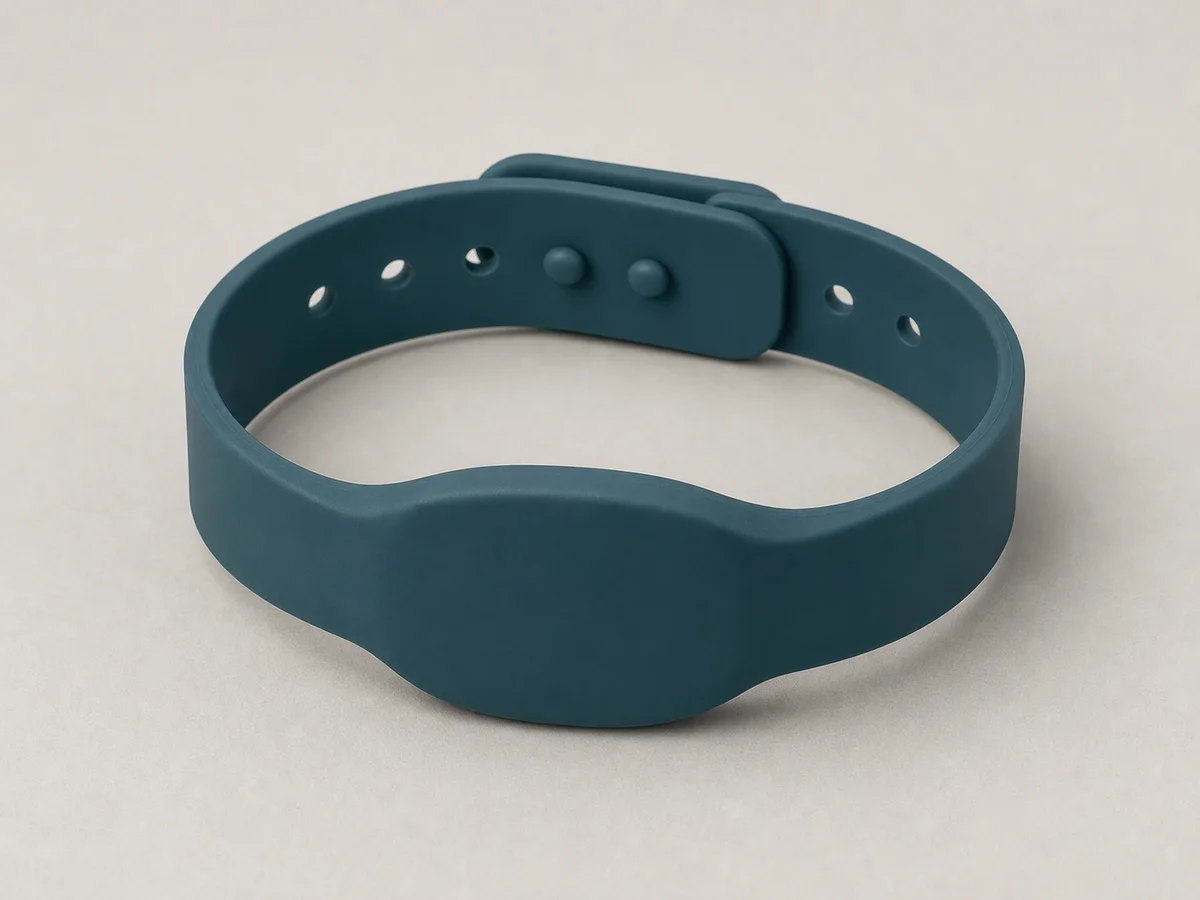 Thick dark-teal silicone RFID wristband with a broad horizontal oblate face