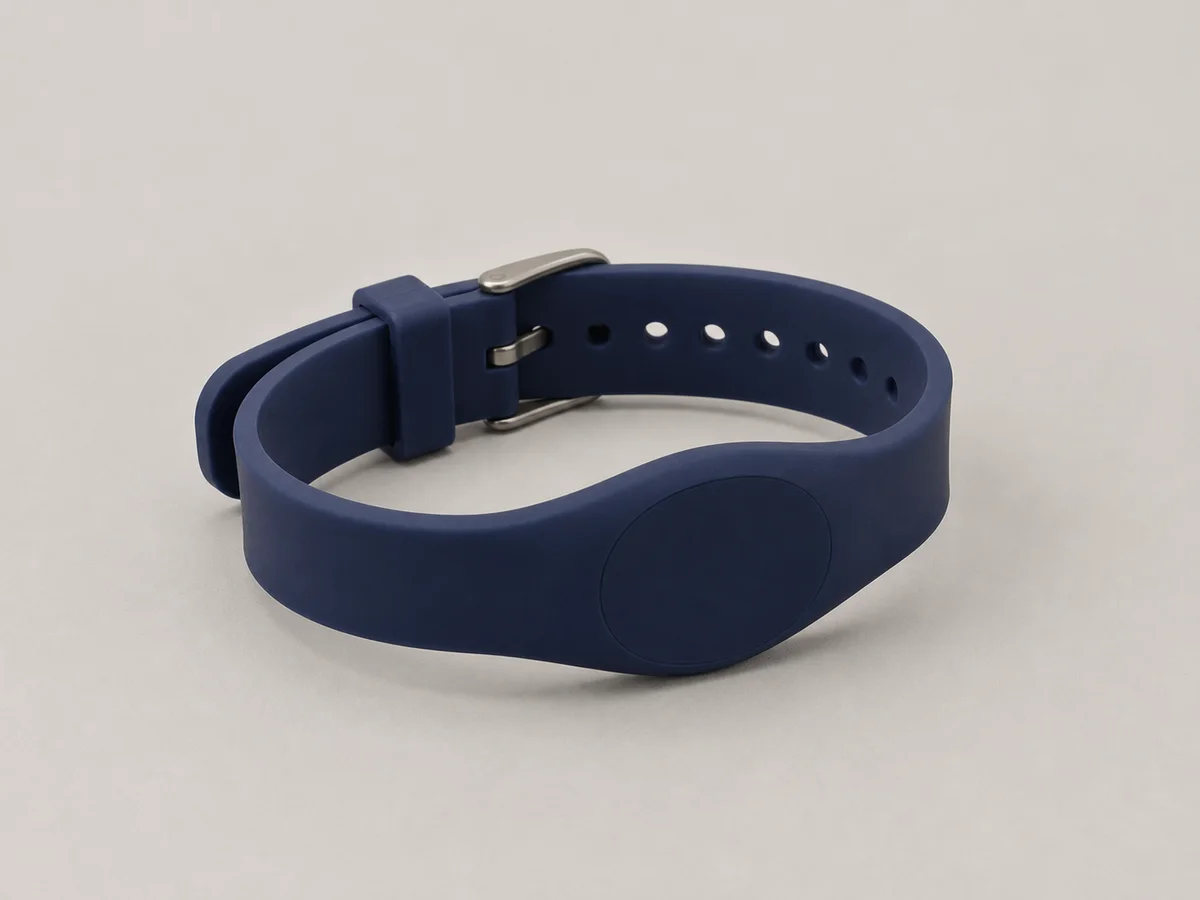Navy watchstrap-style silicone RFID wristband with a plain oval passive module