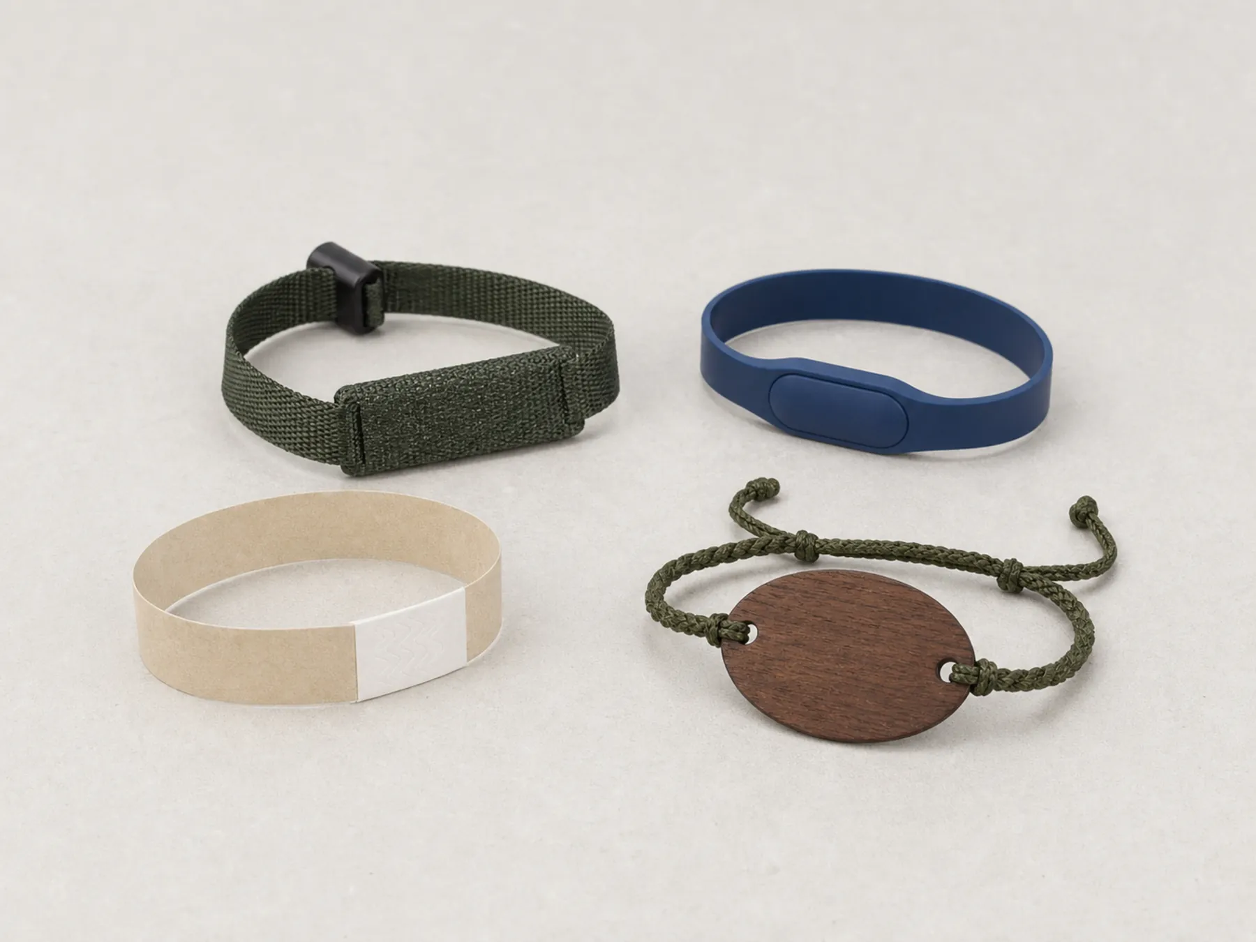 A realistic family of silicone, woven, paper and wood RFID wristband constructions