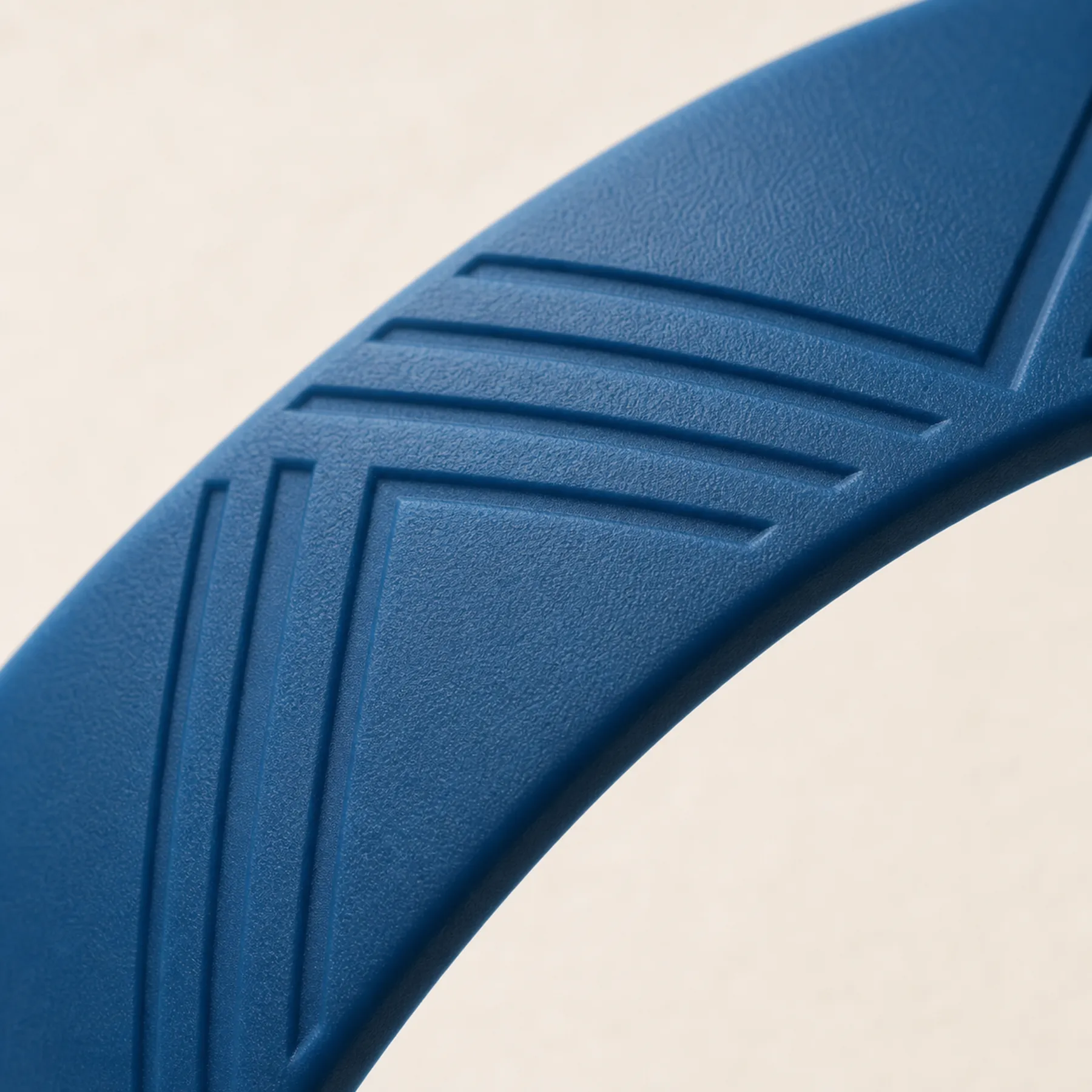 Macro view of realistic debossed detail on a molded silicone wristband