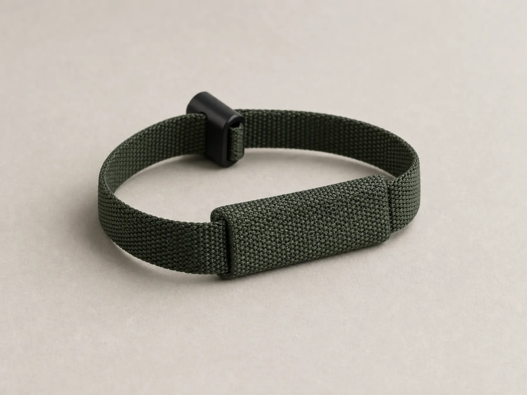 A low-profile woven RFID wristband with a realistic sliding adjuster